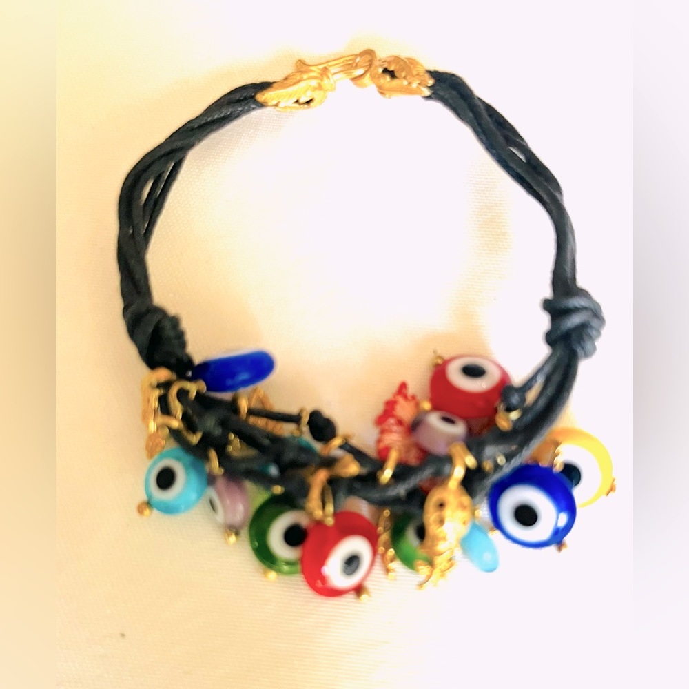 Black rope bracelet with chunky multiple colored glass evil eye & silver charm
